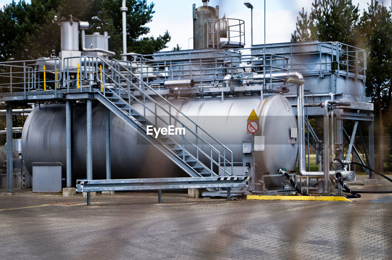 Storage tanks in refinery building