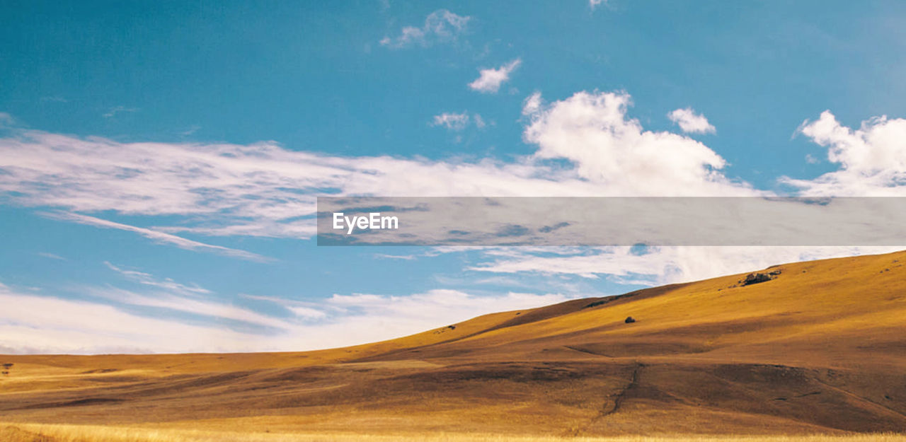 Scenic view of desert against sky