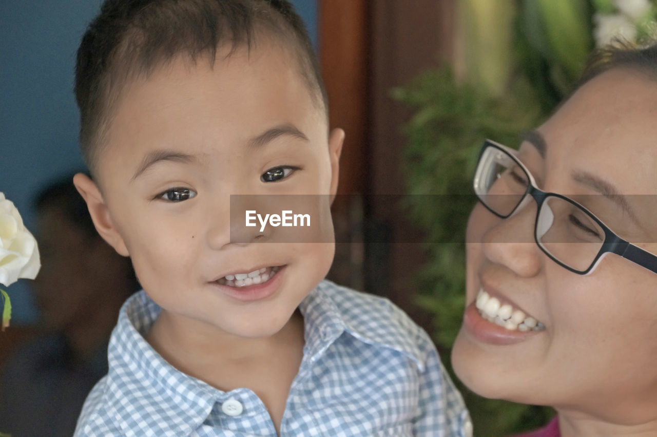 Close-up of cheerful mother and son