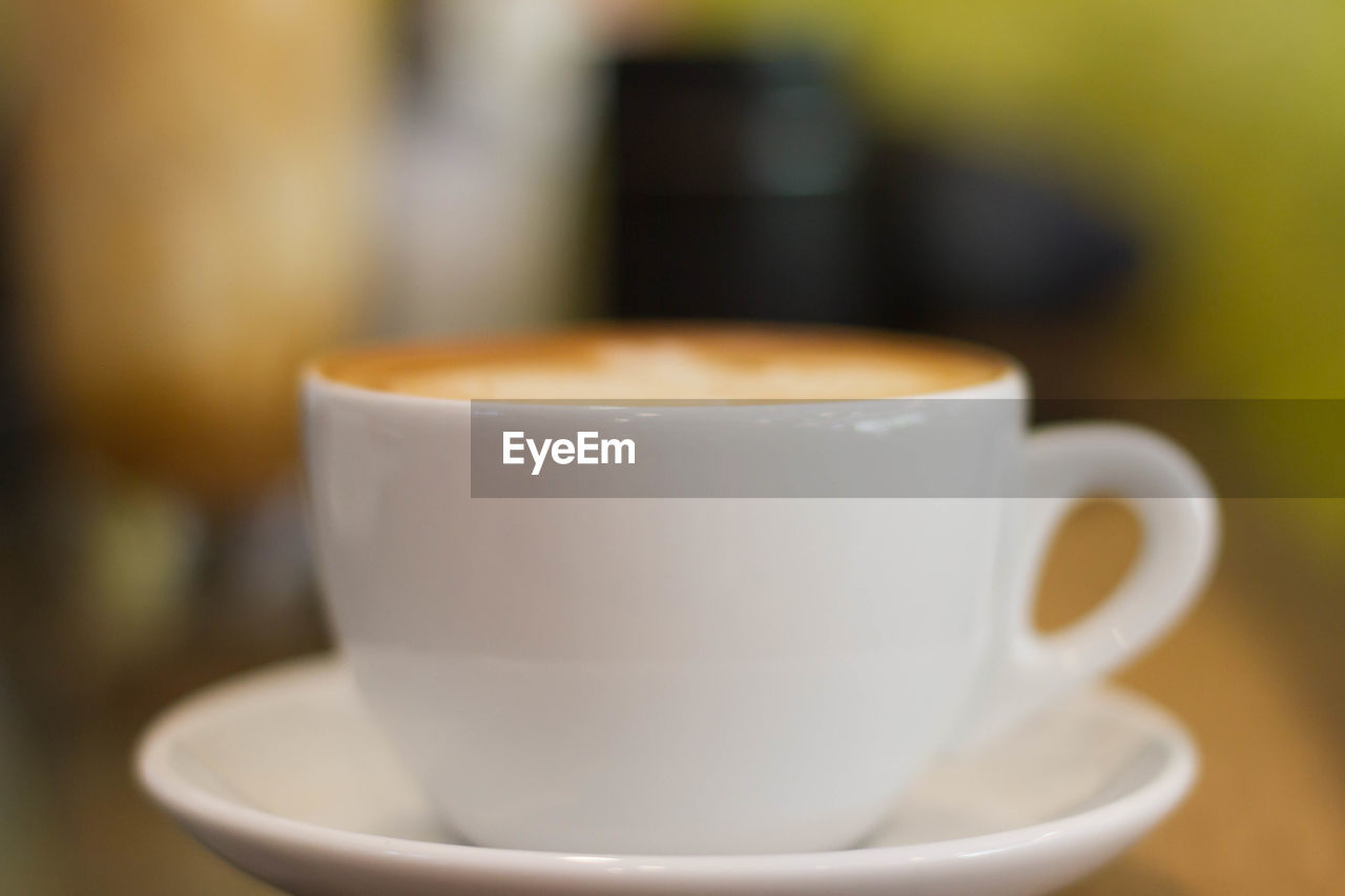 Close-up of fresh cappuccinos on table