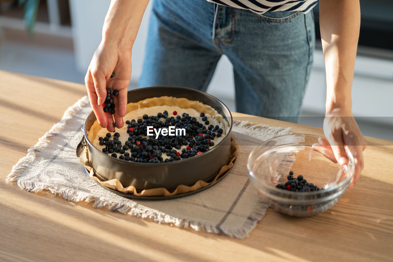 midsection of person preparing food