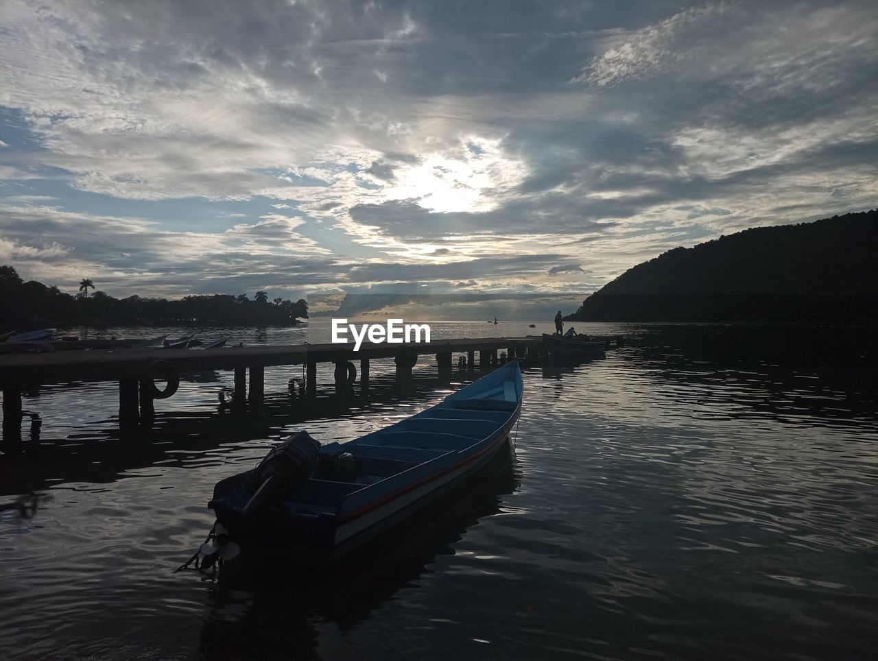 water, sky, reflection, nautical vessel, cloud, sea, transportation, nature, mode of transportation, dusk, beauty in nature, sunset, scenics - nature, vehicle, horizon, travel destinations, tranquility, pier, evening, boat, travel, body of water, ocean, tranquil scene, no people, bay, moored, architecture, outdoors, coast, wave, shore, sunlight, land, beach, tourism, holiday, vacation, trip