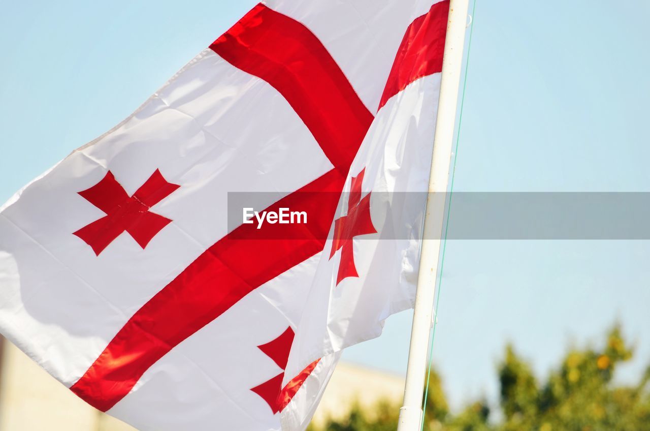 LOW ANGLE VIEW OF FLAG AGAINST THE SKY