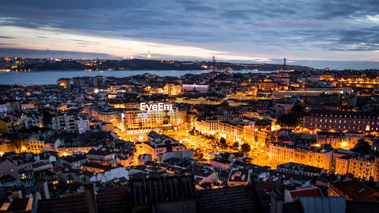 High angle view of illuminated cityscape against sky