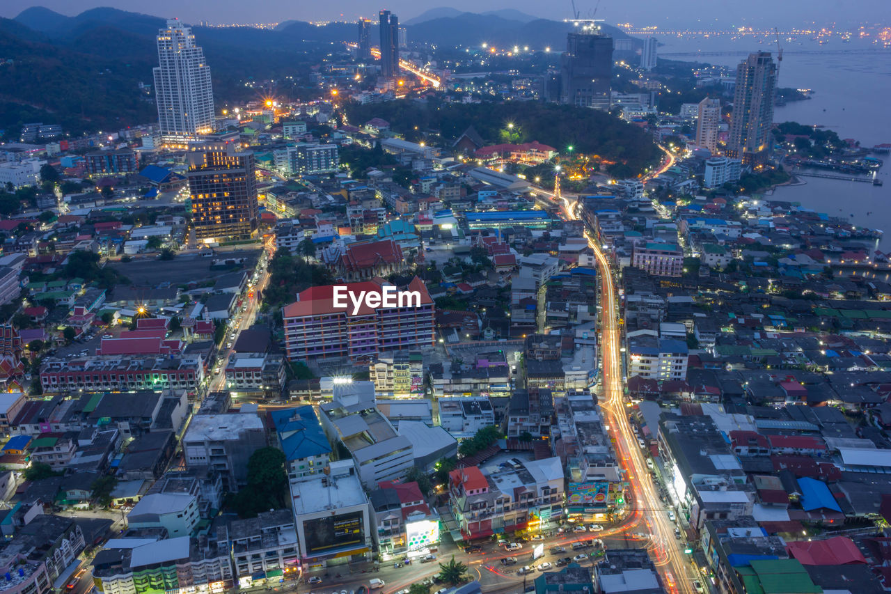 High angle view of illuminated buildings in city at night