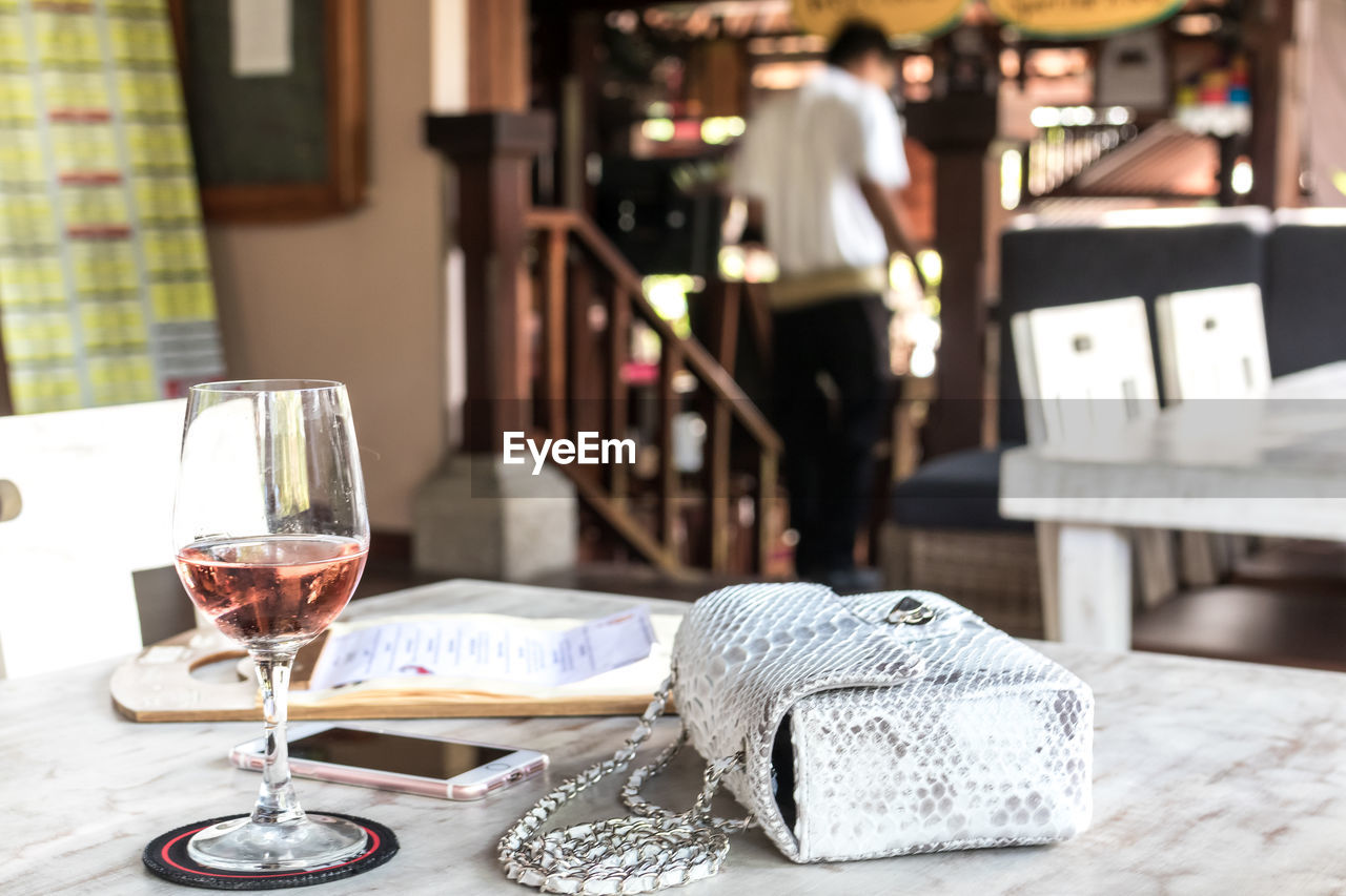 Python skin bag on a table in a restaurant