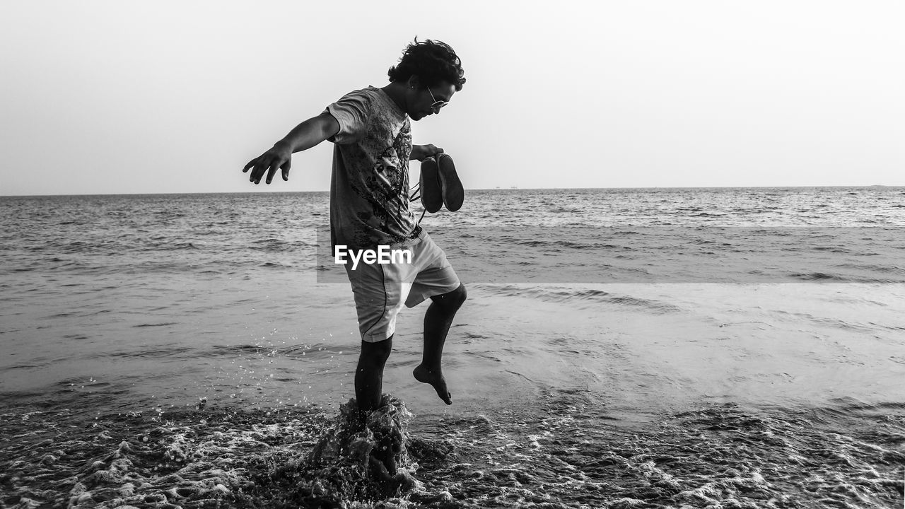 FULL LENGTH OF PERSON ON BEACH