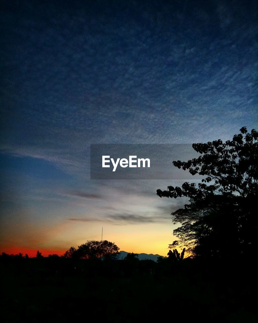 SILHOUETTE LANDSCAPE AGAINST SKY DURING SUNSET