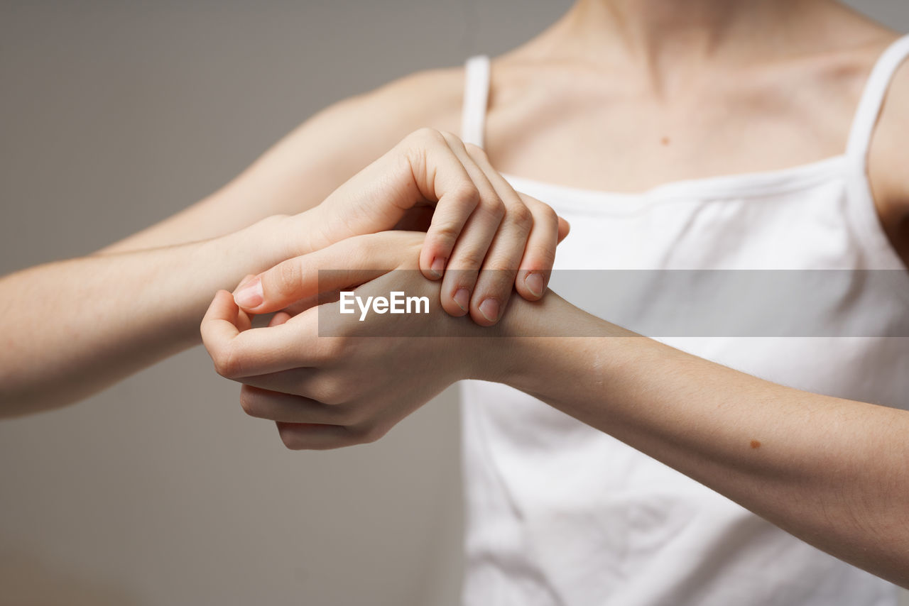 Close-up of woman holding hands