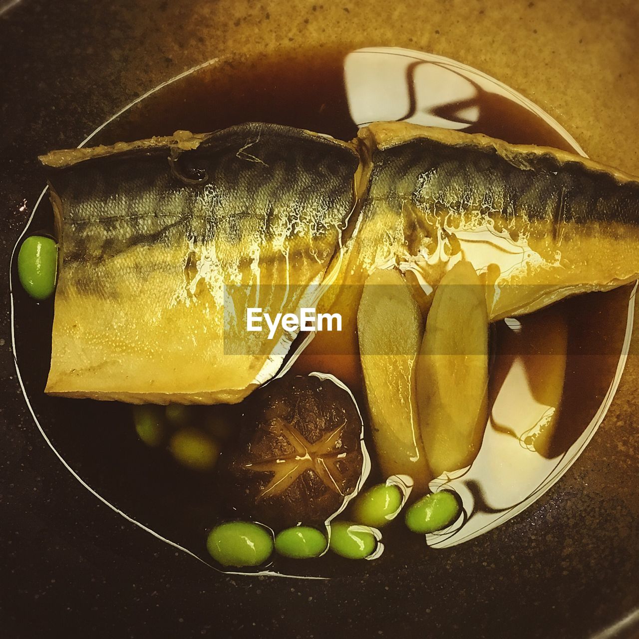 High angle view of fish with vegetables in bowl