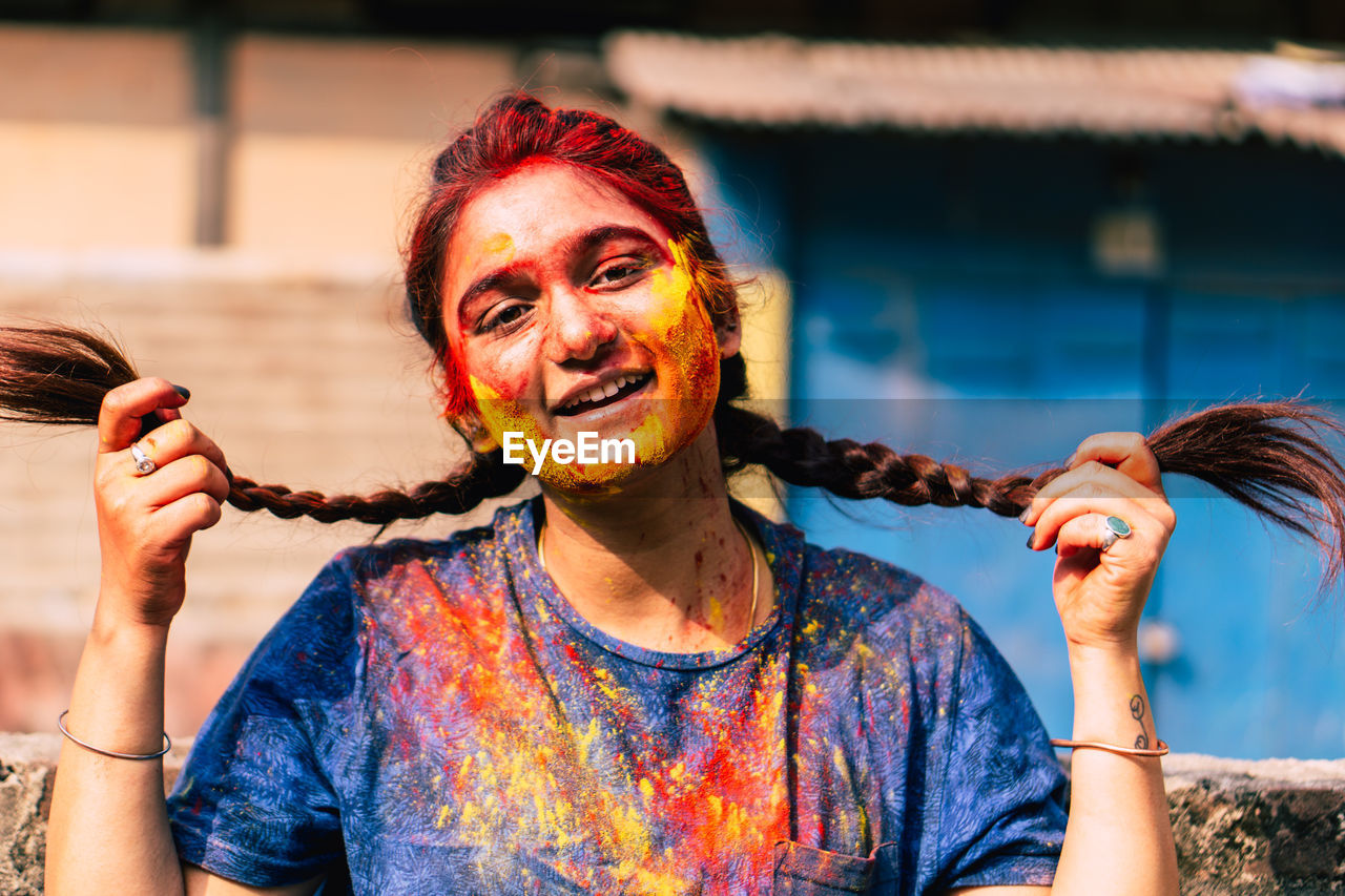 Close-up portrait of woman covered with powder paint