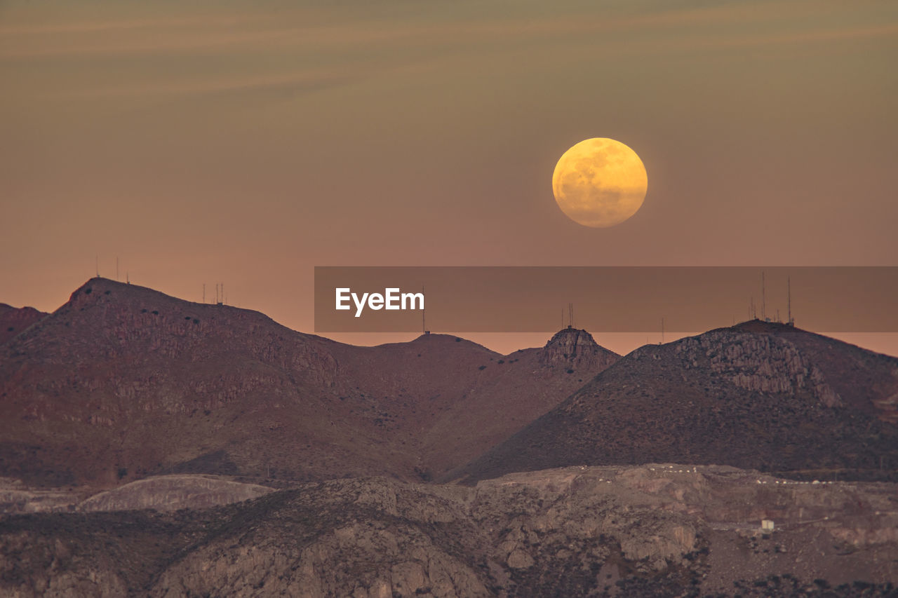 Scenic view of mountains against sky during sunset