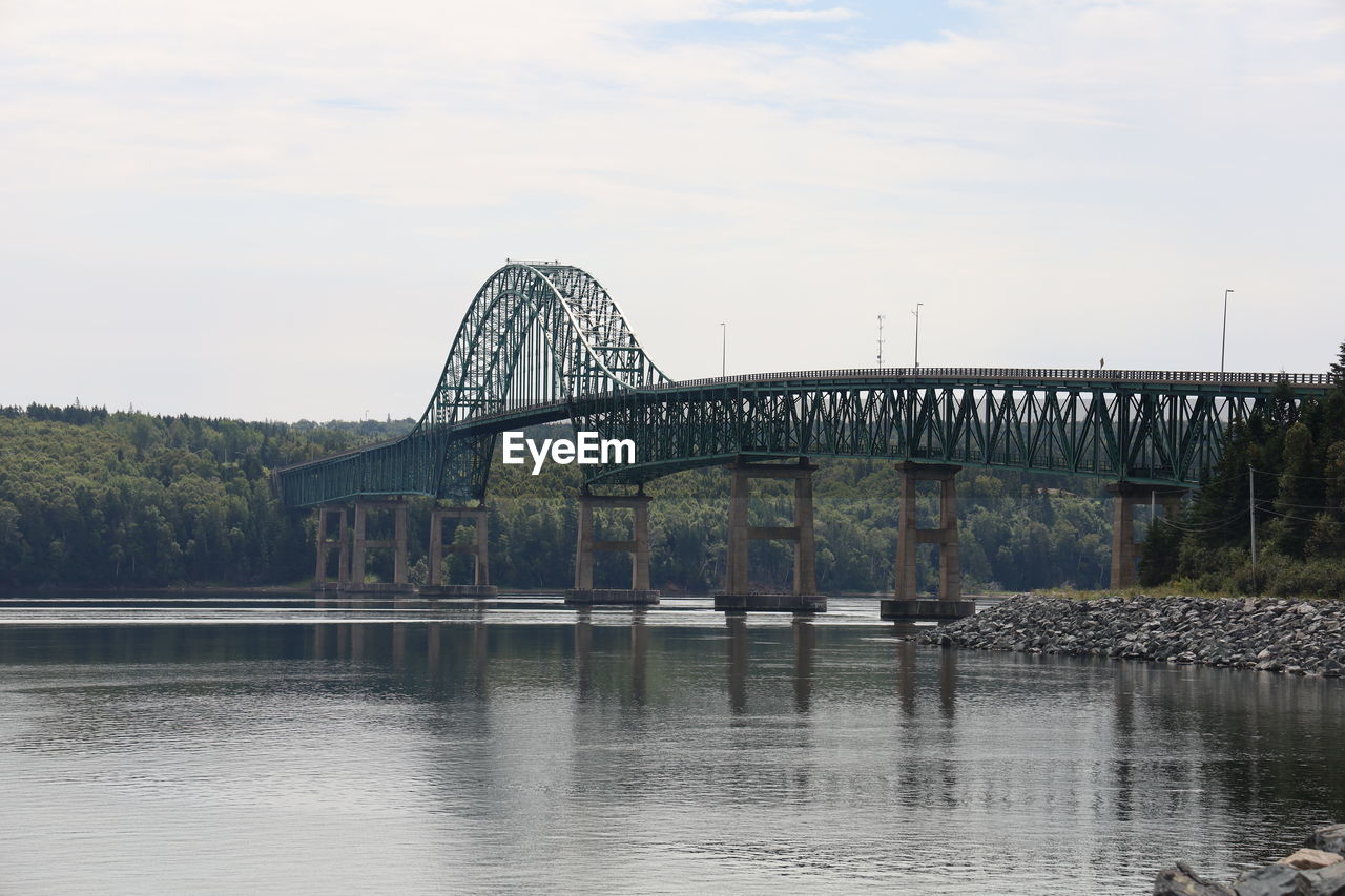 bridge, water, architecture, built structure, river, sky, reflection, nature, arch bridge, transportation, travel destinations, no people, cantilever bridge, travel, outdoors, cloud, city, landmark, day, tourism, tree, waterfront, reservoir, waterway