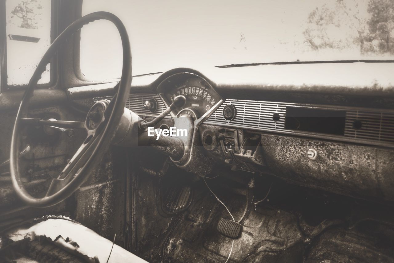 Close-up of abandoned steering wheel