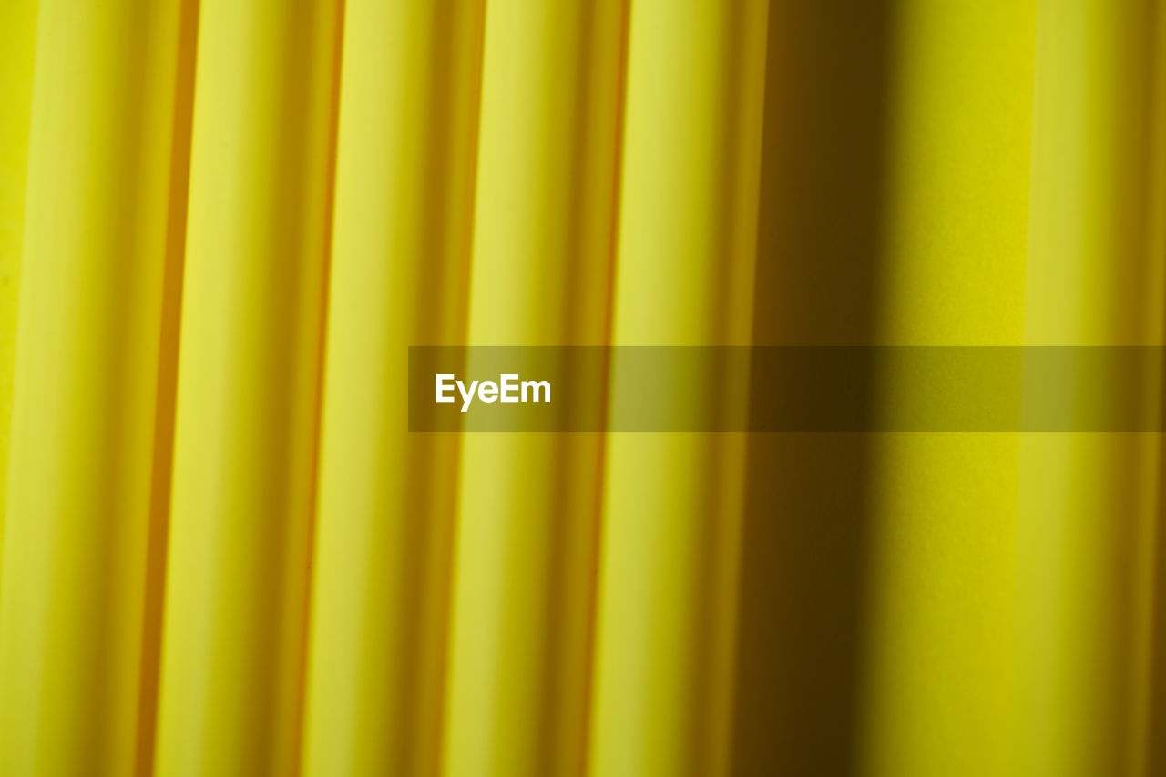 FULL FRAME SHOT OF GREEN YELLOW CURTAIN