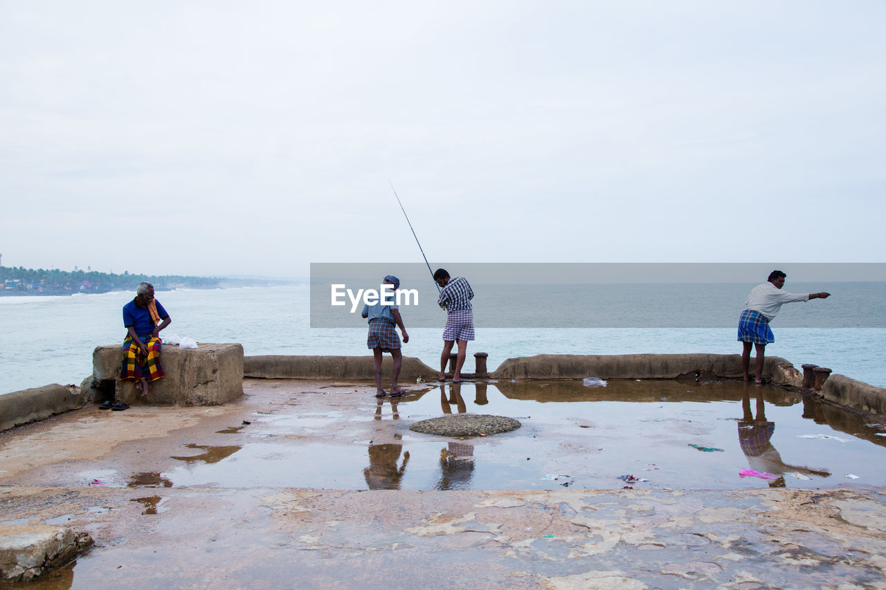 People fishing in sea