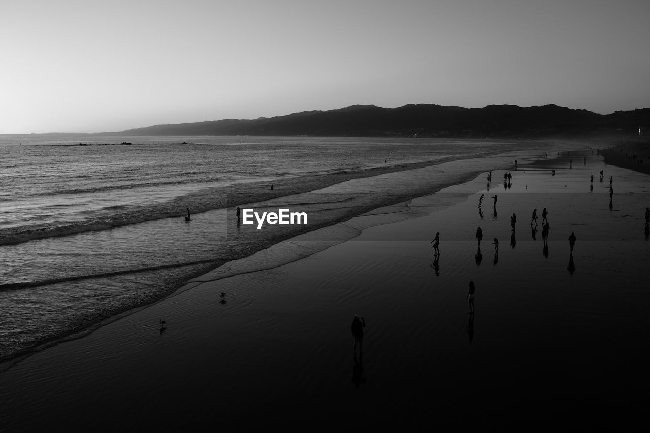 Scenic view of beach against clear sky