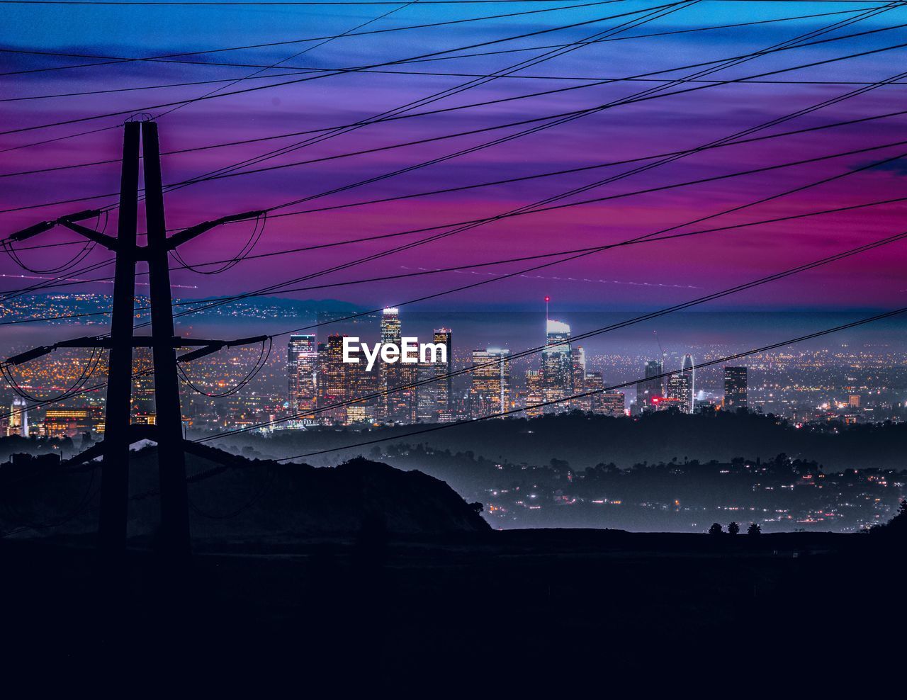 ELECTRICITY PYLONS AT NIGHT