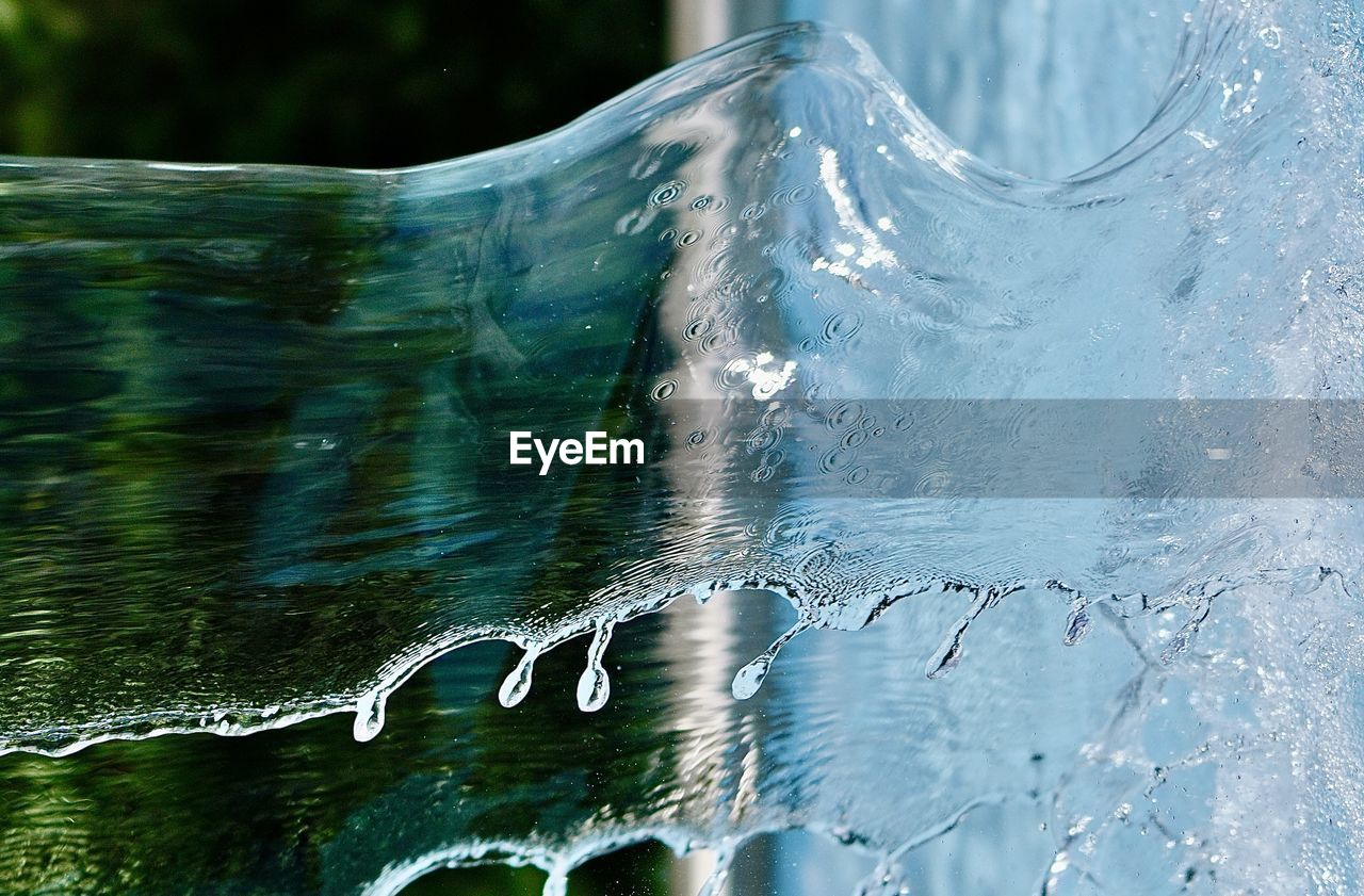 water, reflection, wave, ice, nature, no people, motion, close-up, outdoors, day, blue, freezing, sunlight, environment