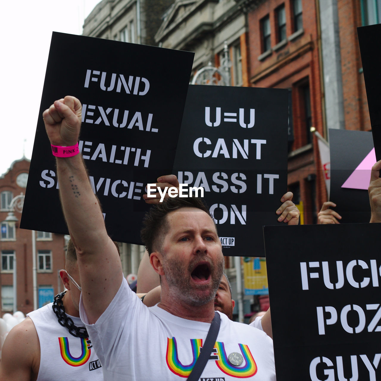 MAN WITH TEXT AGAINST THE SIGN