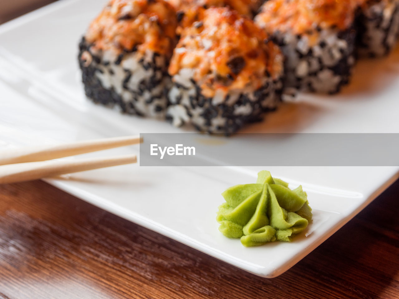 Wasabi sauce and rolls with eel, shiitake, black sesame, spicy sauce. asian cuisine - sushi.