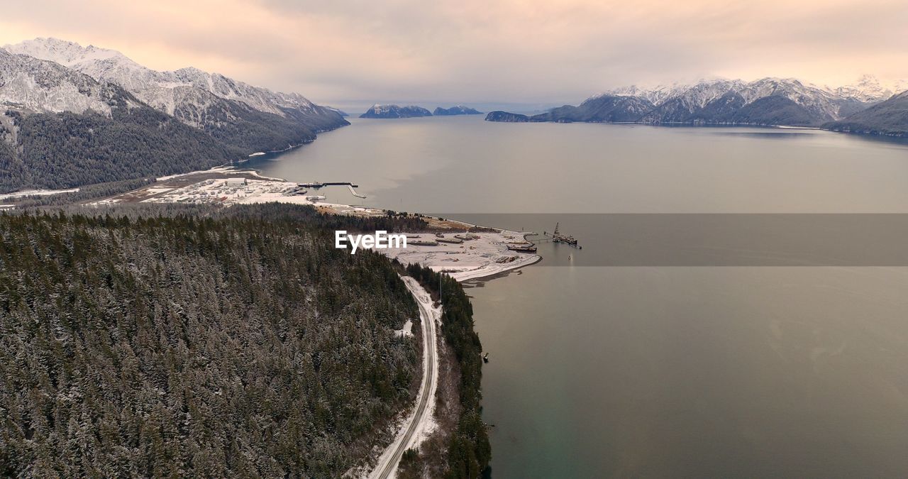 Scenic view of lake against sky during winter