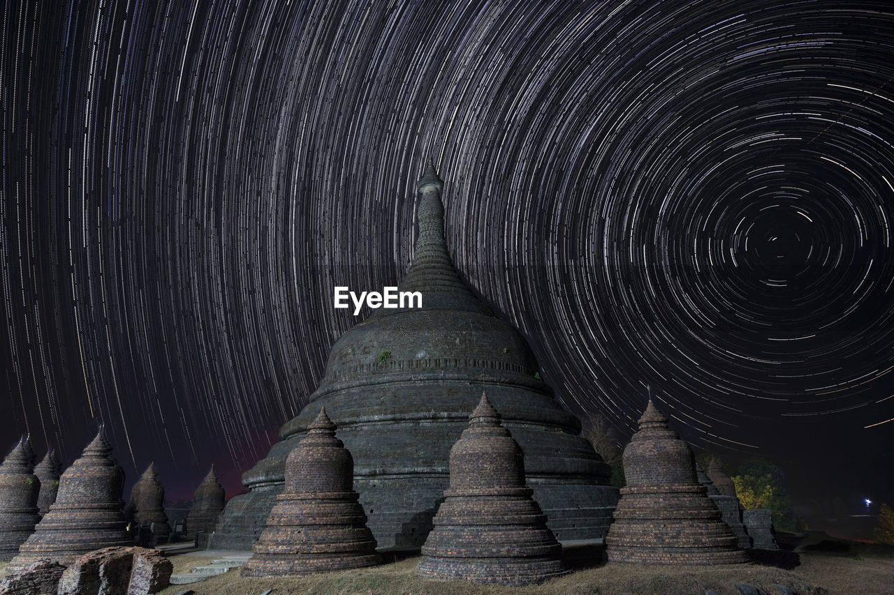 Stupas against star trail