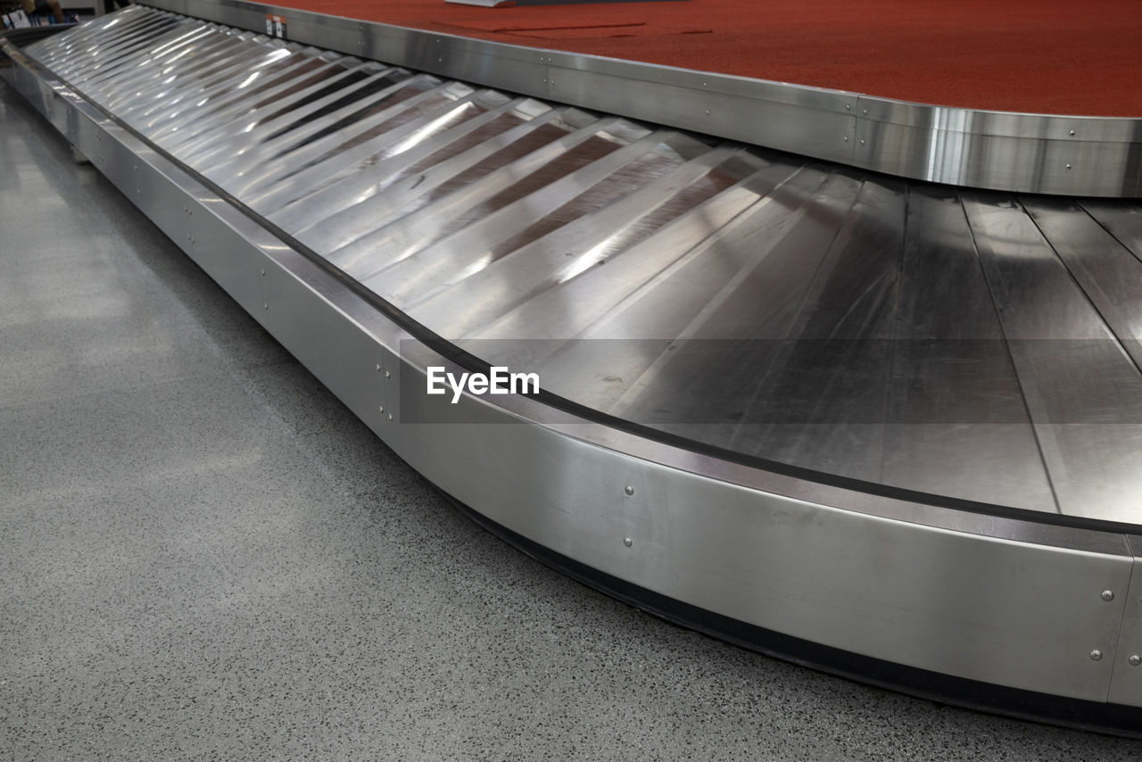 indoors, escalator, silver, metal, automotive exterior, architecture, technology, transportation, iron, shiny, business, no people, steel, stainless steel, conveyor belt, futuristic