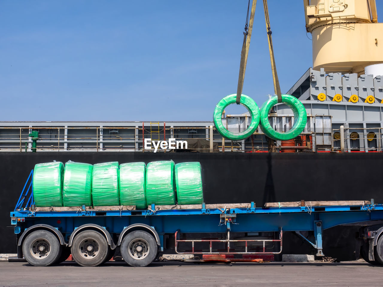 The vessel discharging steel wire rods on truck at industrial port of thailand.