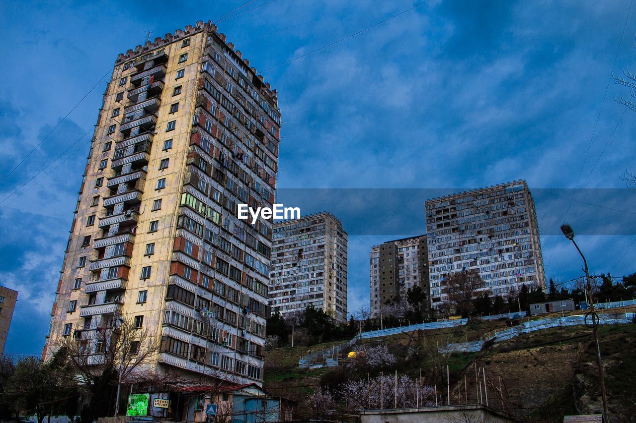 Low angle view of buildings against sky in city