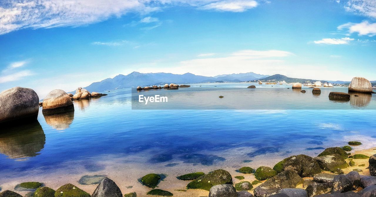 Scenic view of lake against blue sky