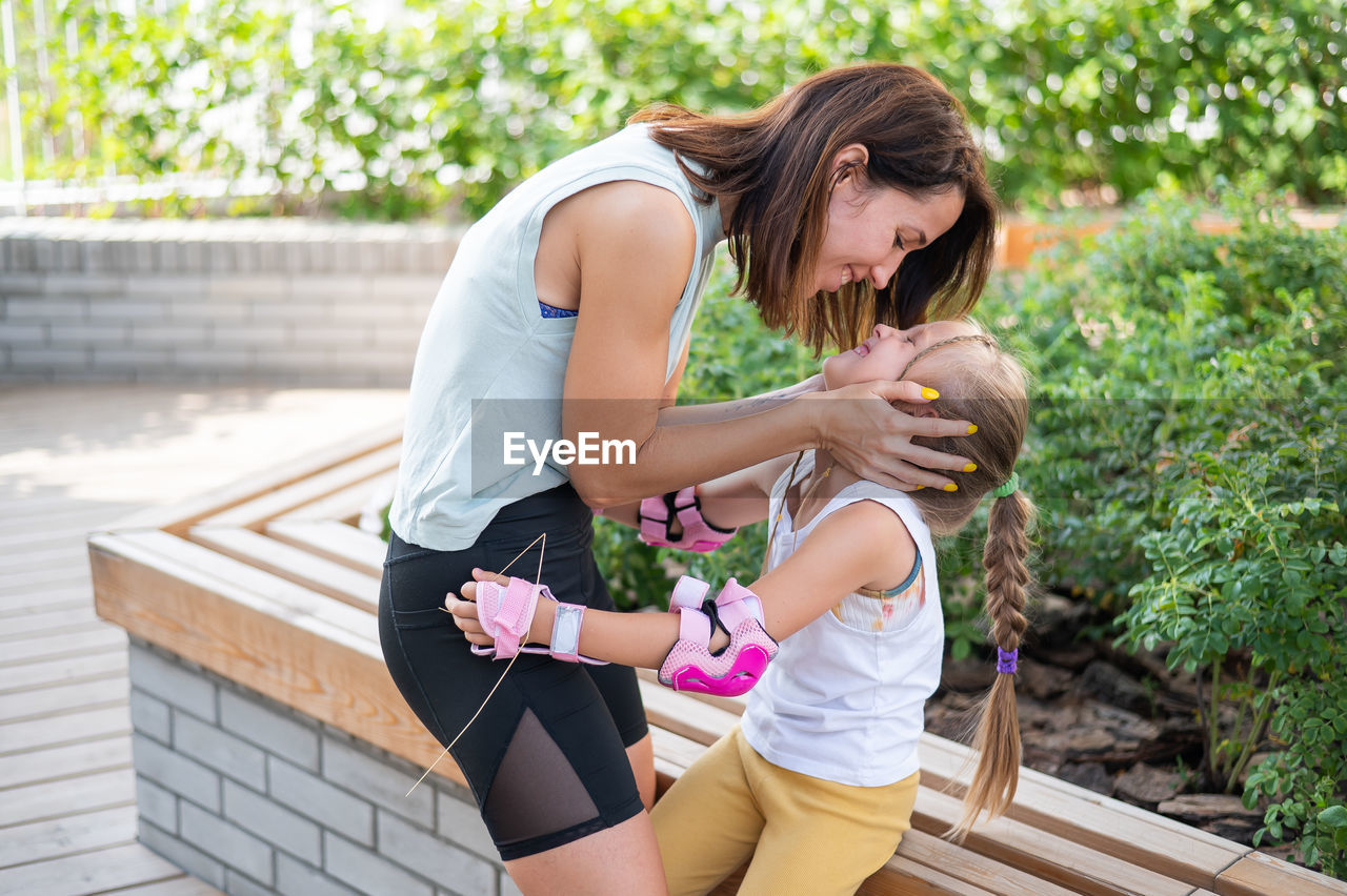 side view of young woman exercising at park