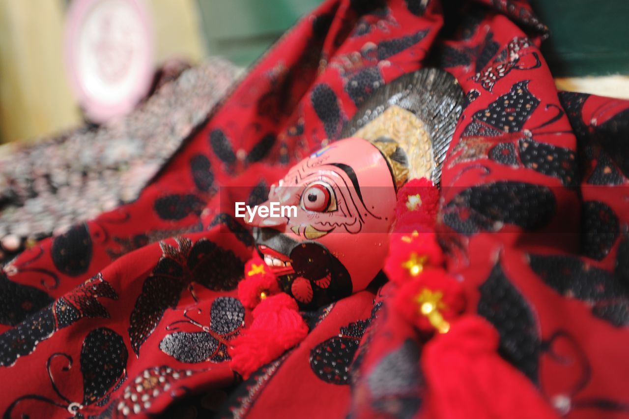 CLOSE-UP OF CHRISTMAS DECORATIONS ON FABRIC