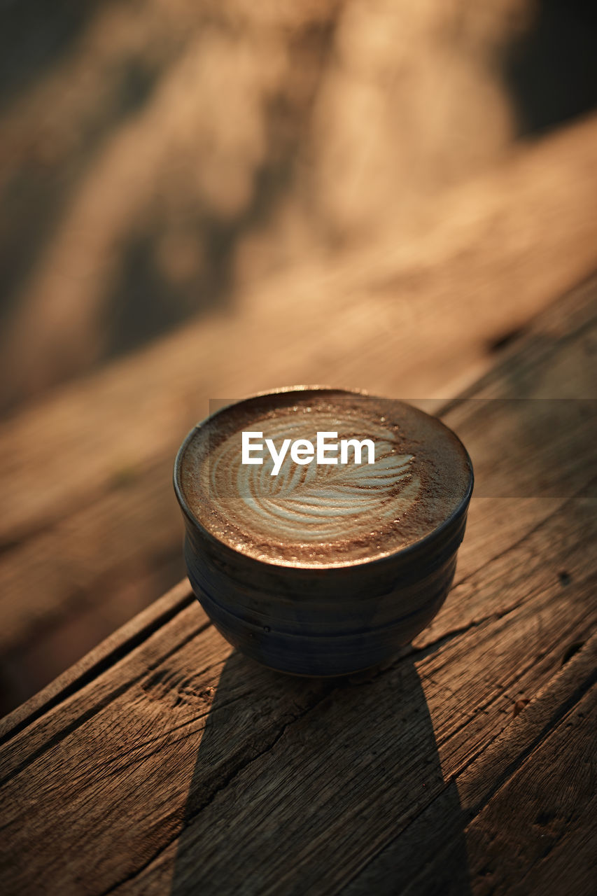 close-up, wood, macro photography, coin, finance, no people, morning, currency, light, business, food and drink, darkness, black, focus on foreground, still life, shadow, wealth, table, circle