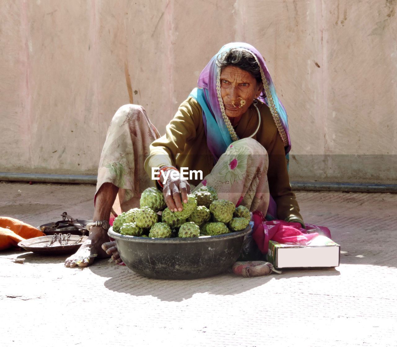 Full length woman selling fruits outdoors