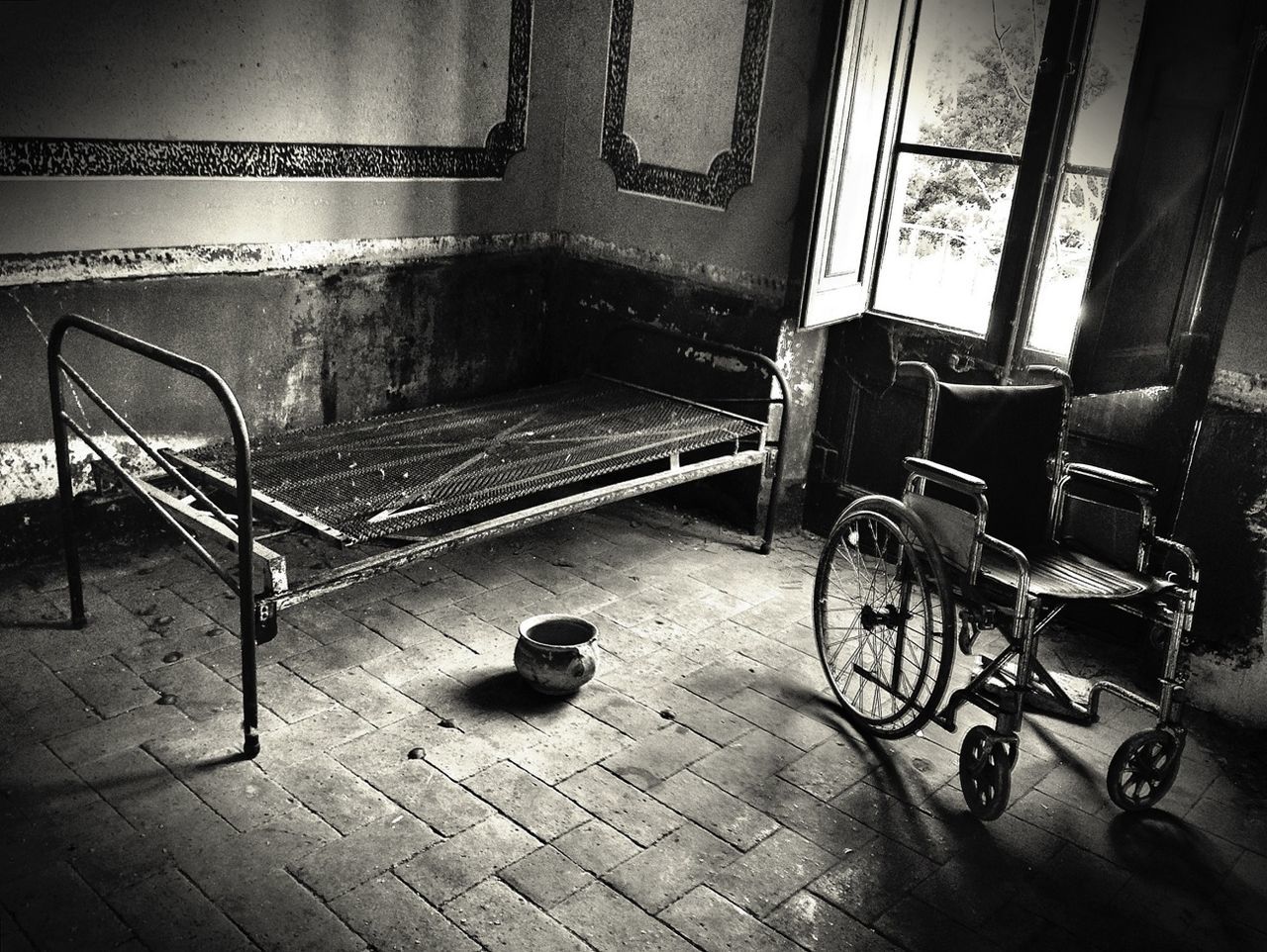 Abandoned wheelchair and bed