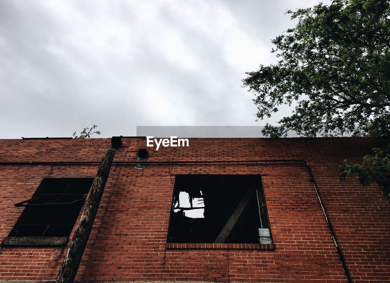 Low angle view of old building against sky