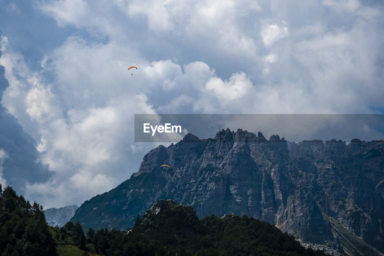 SCENIC VIEW OF CLOUDS OVER MOUNTAIN