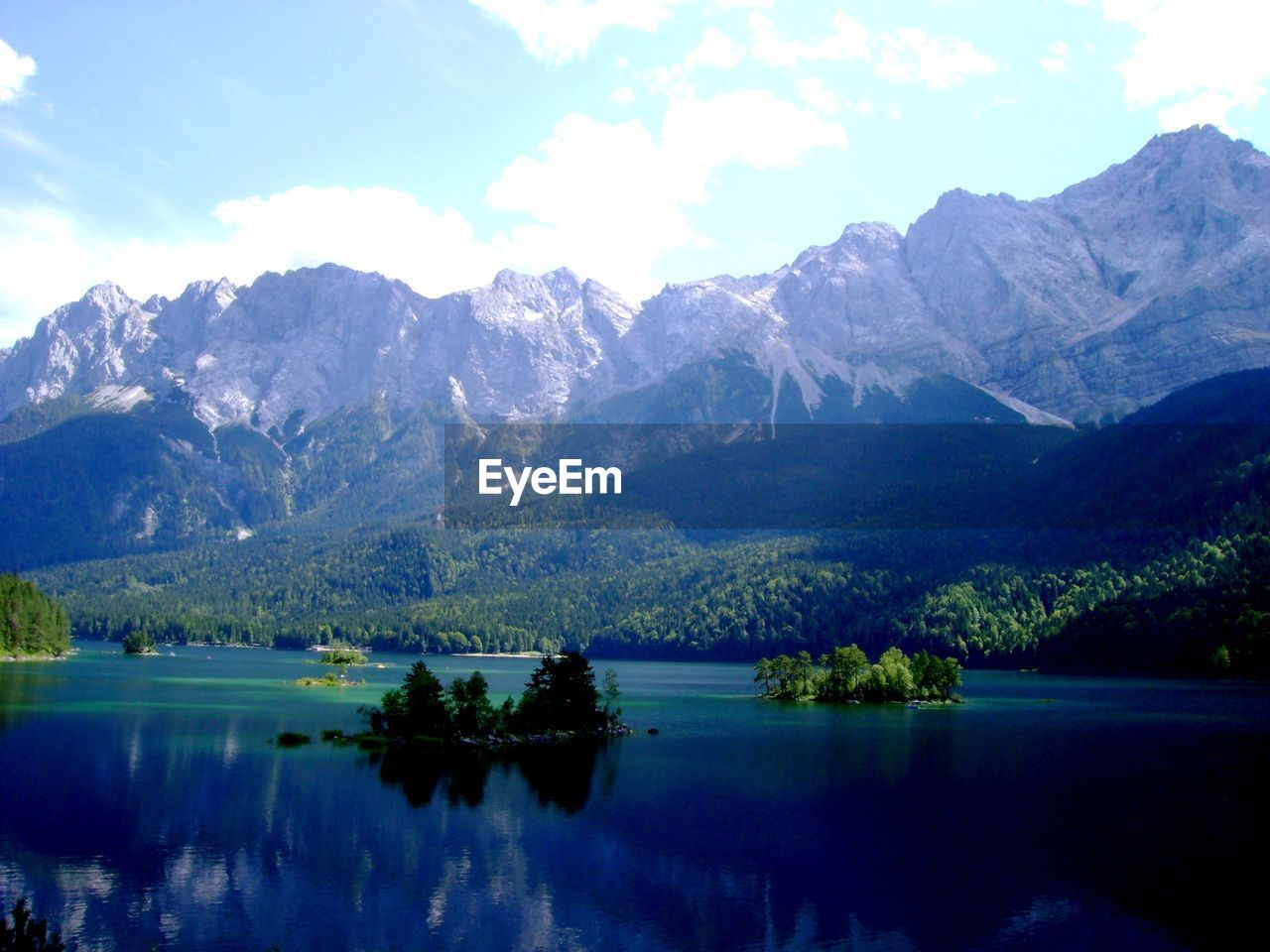 Scenic view of lake with mountains in background