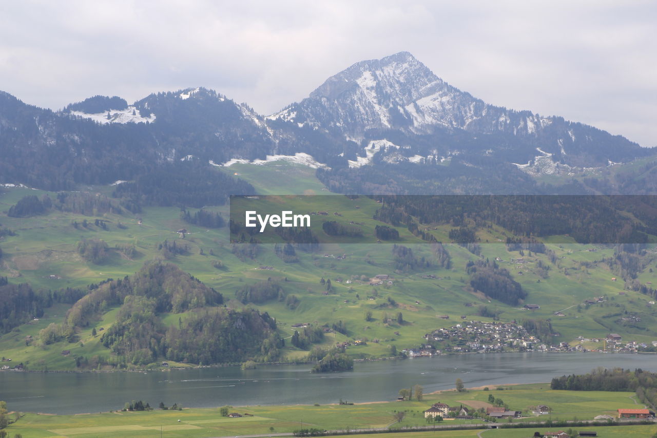 SCENIC VIEW OF LANDSCAPE AND MOUNTAINS AGAINST SKY