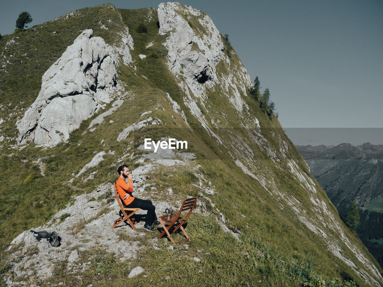 People on rock in mountains