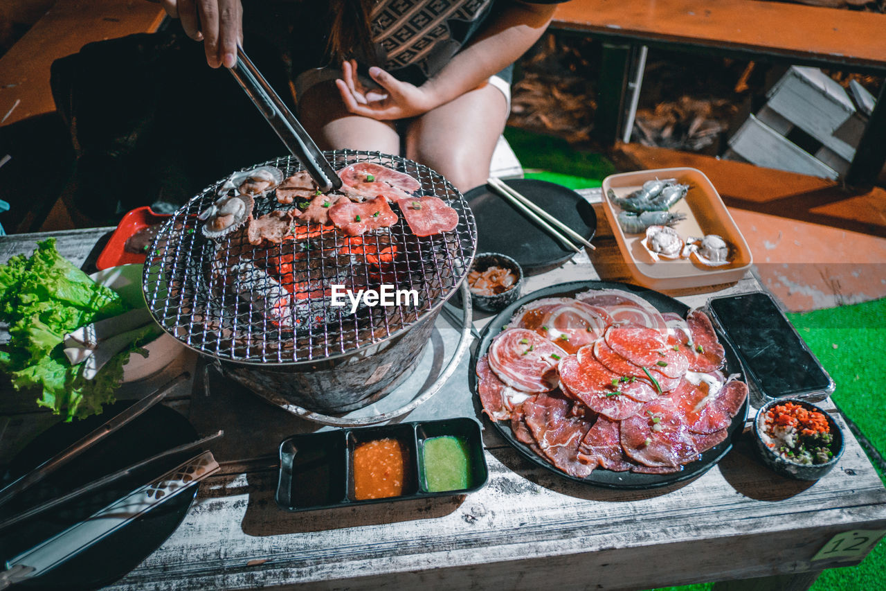 cropped hand of man preparing food