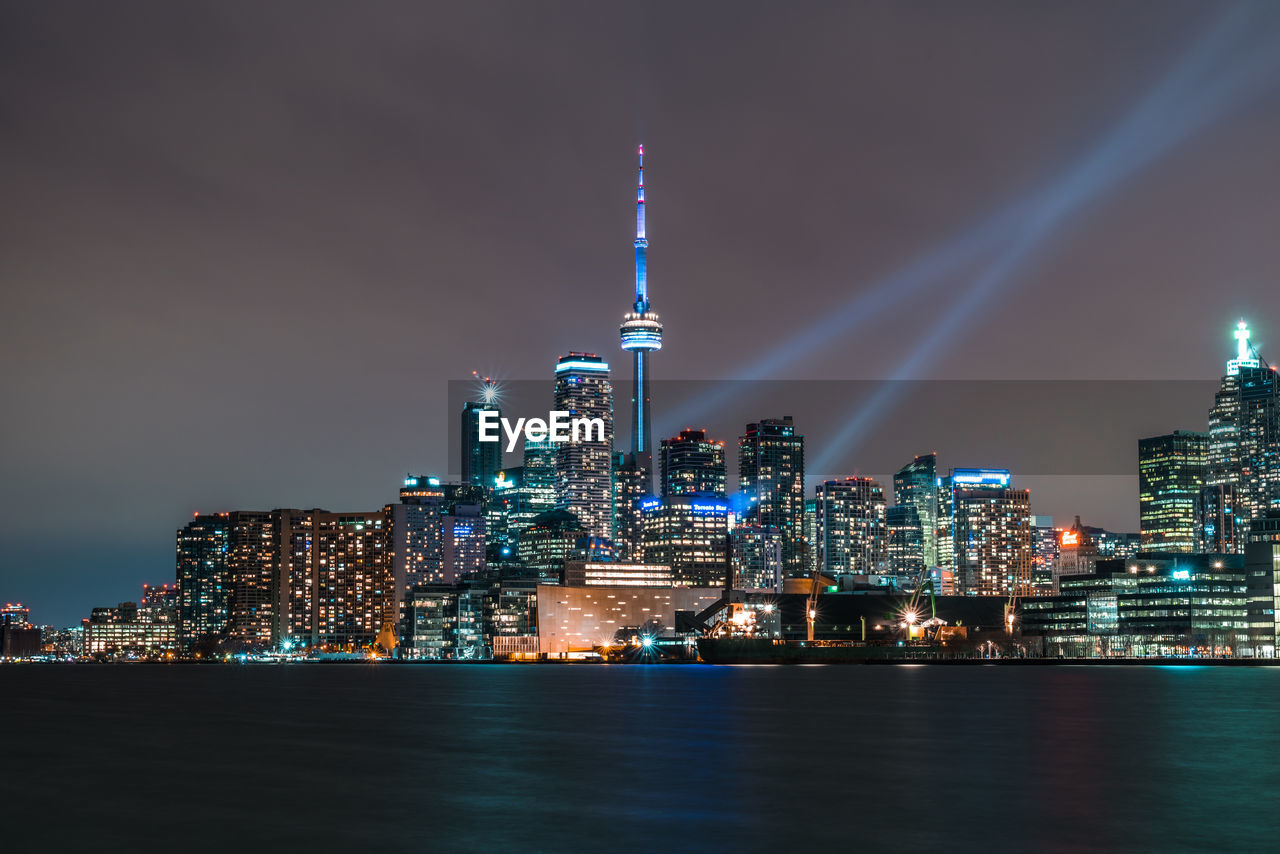 Illuminated buildings in city at night