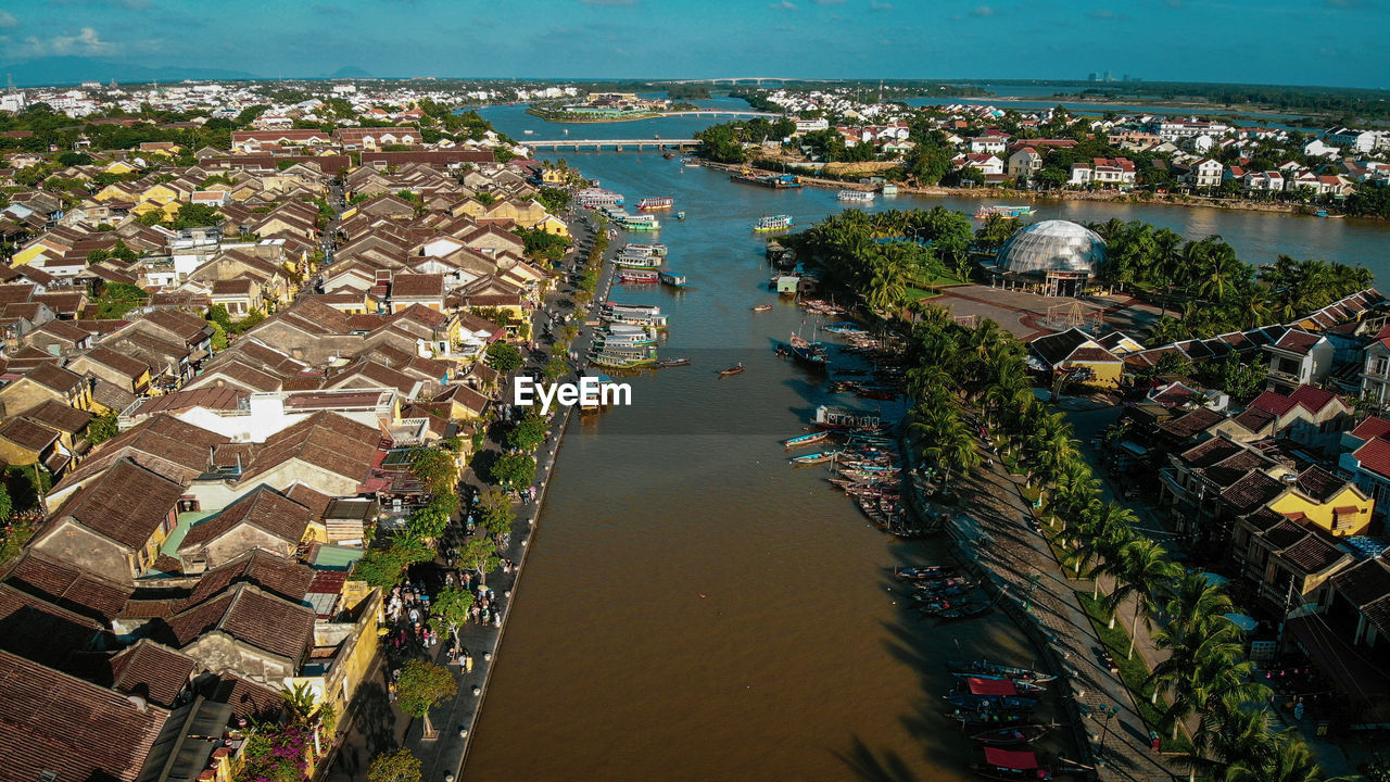 High angle view of river amidst buildings in town