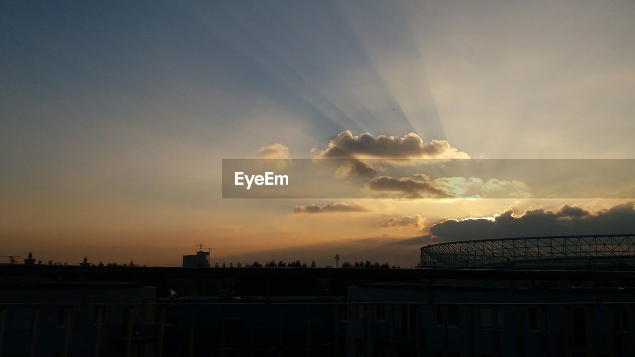 Silhouette building against sky during sunset