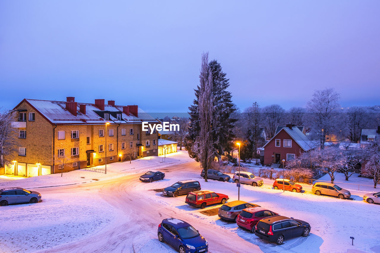Car parking in a residential area in the evening light in winter