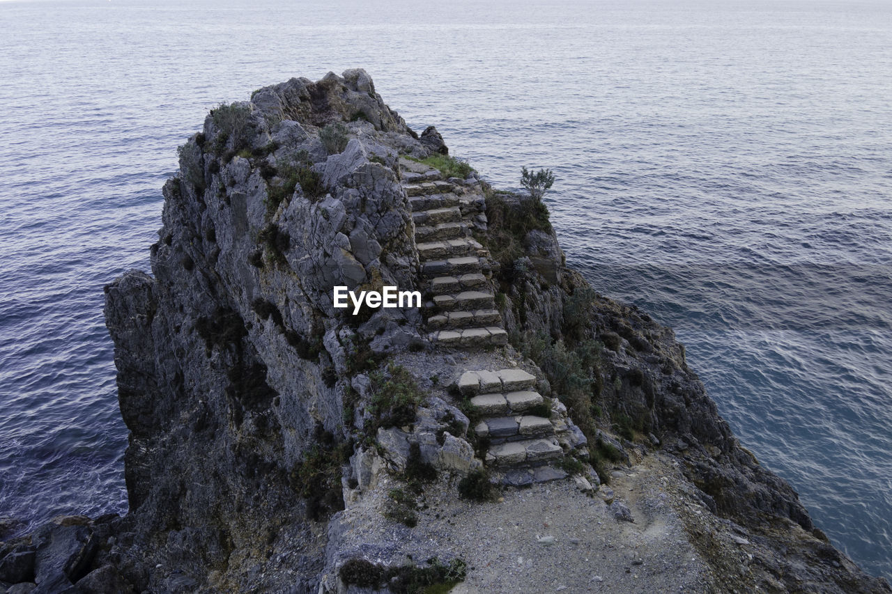 High angle view of rocks by sea