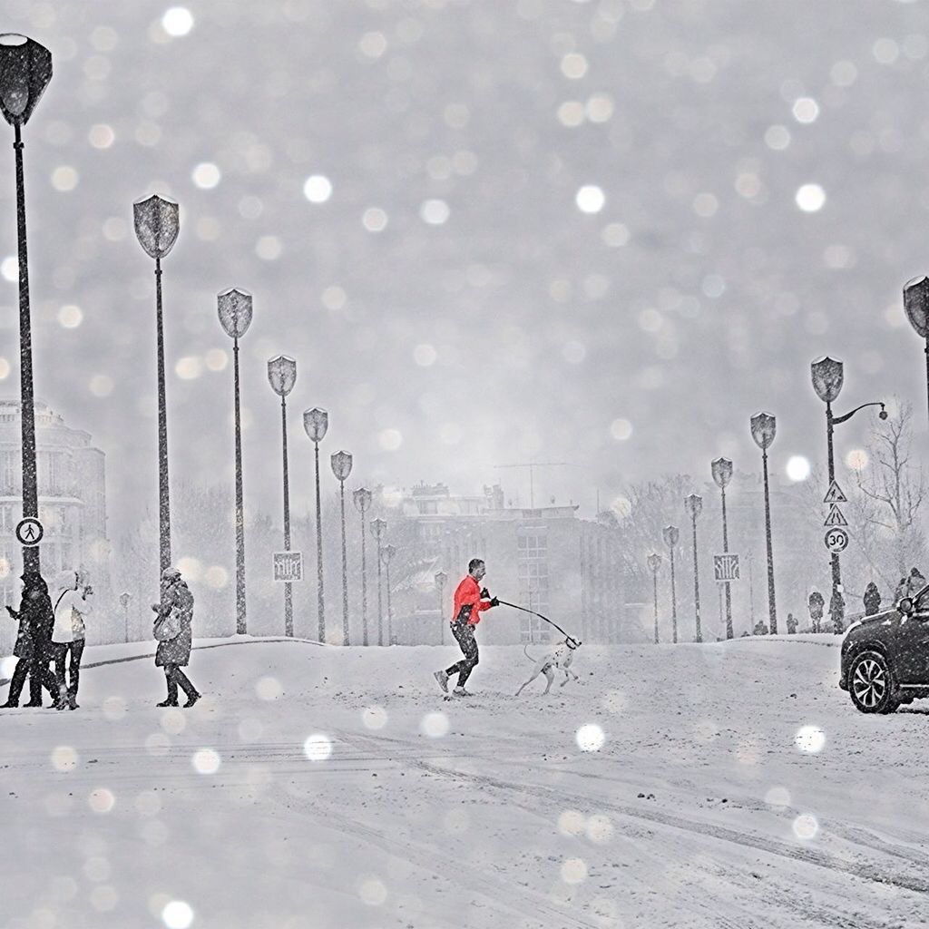 Man running in street in winter