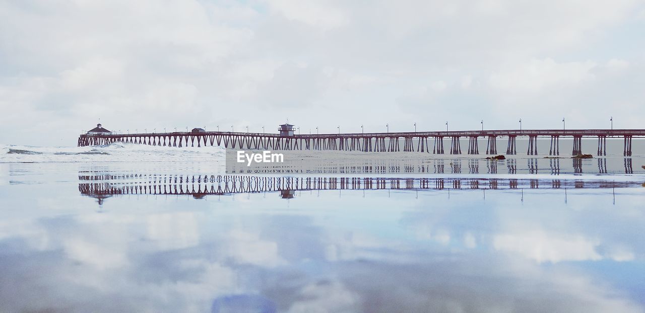 Text on bridge against sky