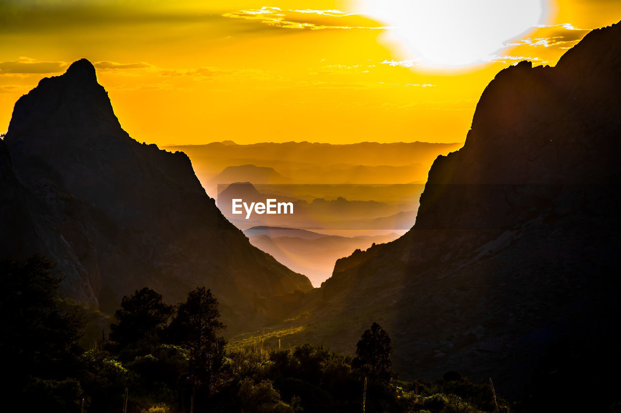 Scenic view of mountains against sky during sunset